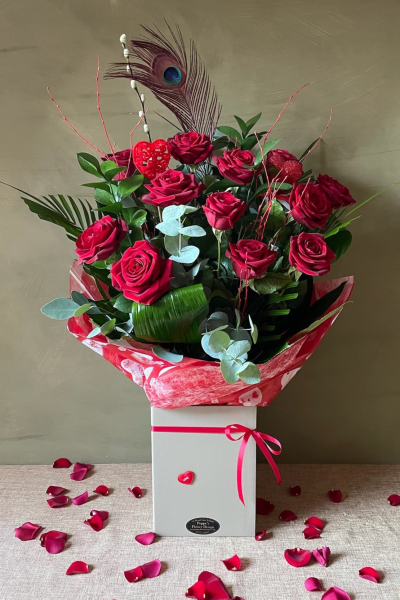 Poppy's Flower Design Florist in Leyland - Spellbound - A dozen premium Red Naomi Roses from Porta Nova with mixed luscious foliage.